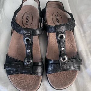 Taos Black Leather Embossed Insole Wedge Sandals